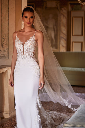 Long and classic Apolonia wedding veil trimmed with floral lace with comb attachment from Dama Couture wedding dress atelier (front photo)