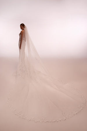 Long and classic Apolonia wedding veil trimmed with floral lace with comb attachment from Dama Couture wedding dress atelier (back photo)
