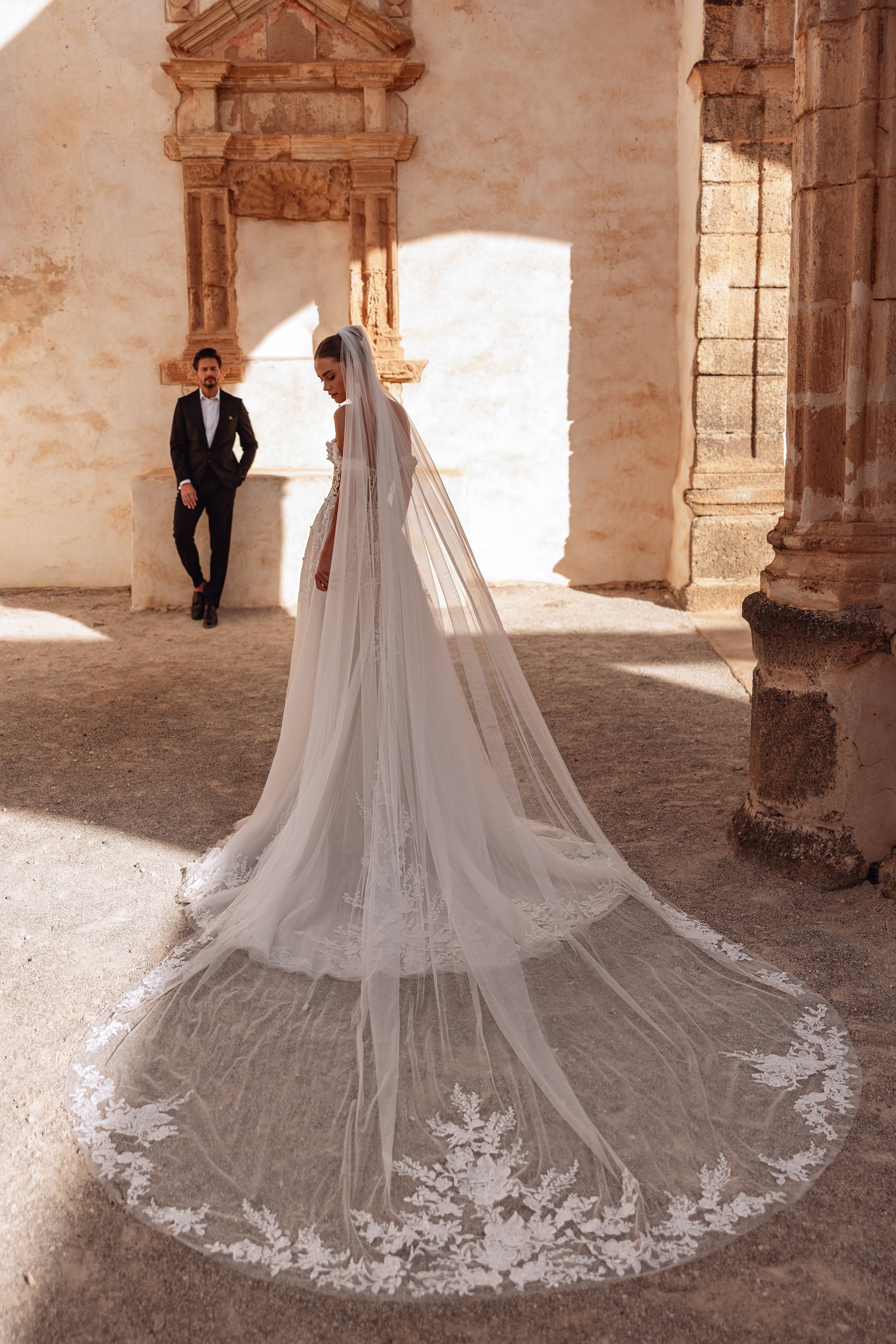 The Ariella cathedral wedding veil with lace trim adds a dramatic and timeless bridal look perfect for elegant ceremonies.