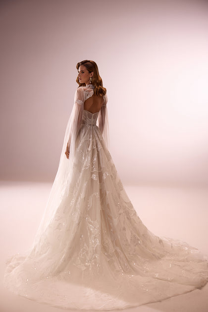 Modern bohemian wedding dress with lace bolero Calla from DAMA Couture (studio back picture)