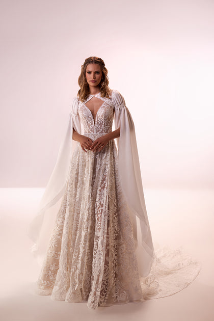 Bohemian wedding dress Cassidy with sleeves for destination wedding from DAMA Couture (studio picture)