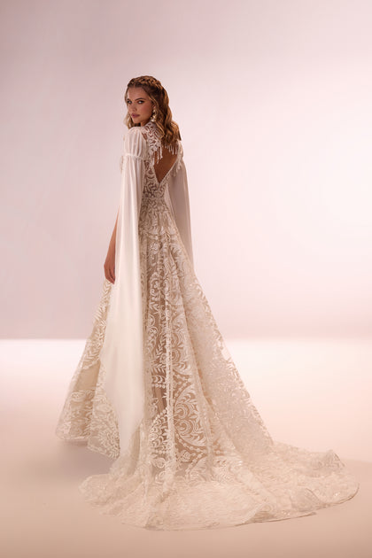 Bohemian wedding dress Cassidy with sleeves for destination wedding from DAMA Couture (studio back picture)