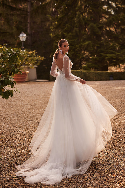 Romantic lace a-line wedding dress with detachable sleeves from DAMA Couture (back full body photo)