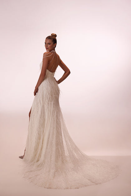 Glamour wedding dress with fathers from DAMA Couture (studio photo)