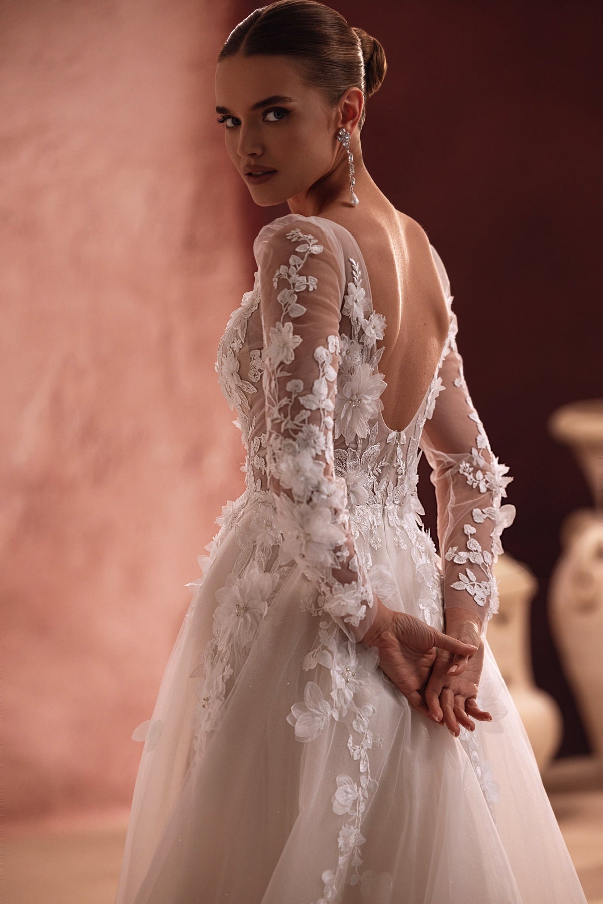 Close-up on the Semiramida corset shows intricately made three-dimensional flower appliqués, giving the gown a rich, textured look.