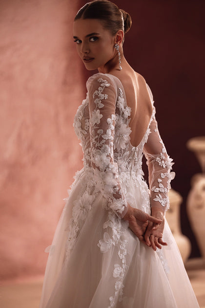 Close-up on the Semiramida corset shows intricately made three-dimensional flower appliqués, giving the gown a rich, textured look.