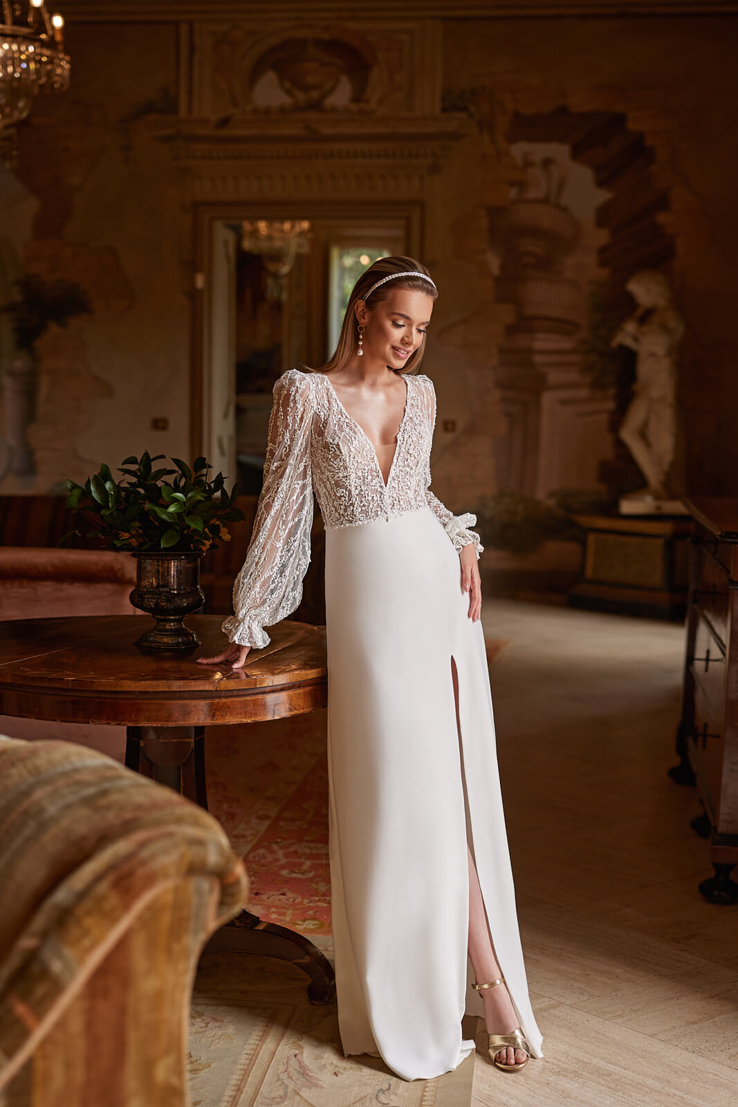 Wedding dress Paula – A-line wedding dress with long sleeves by DAMA Couture.