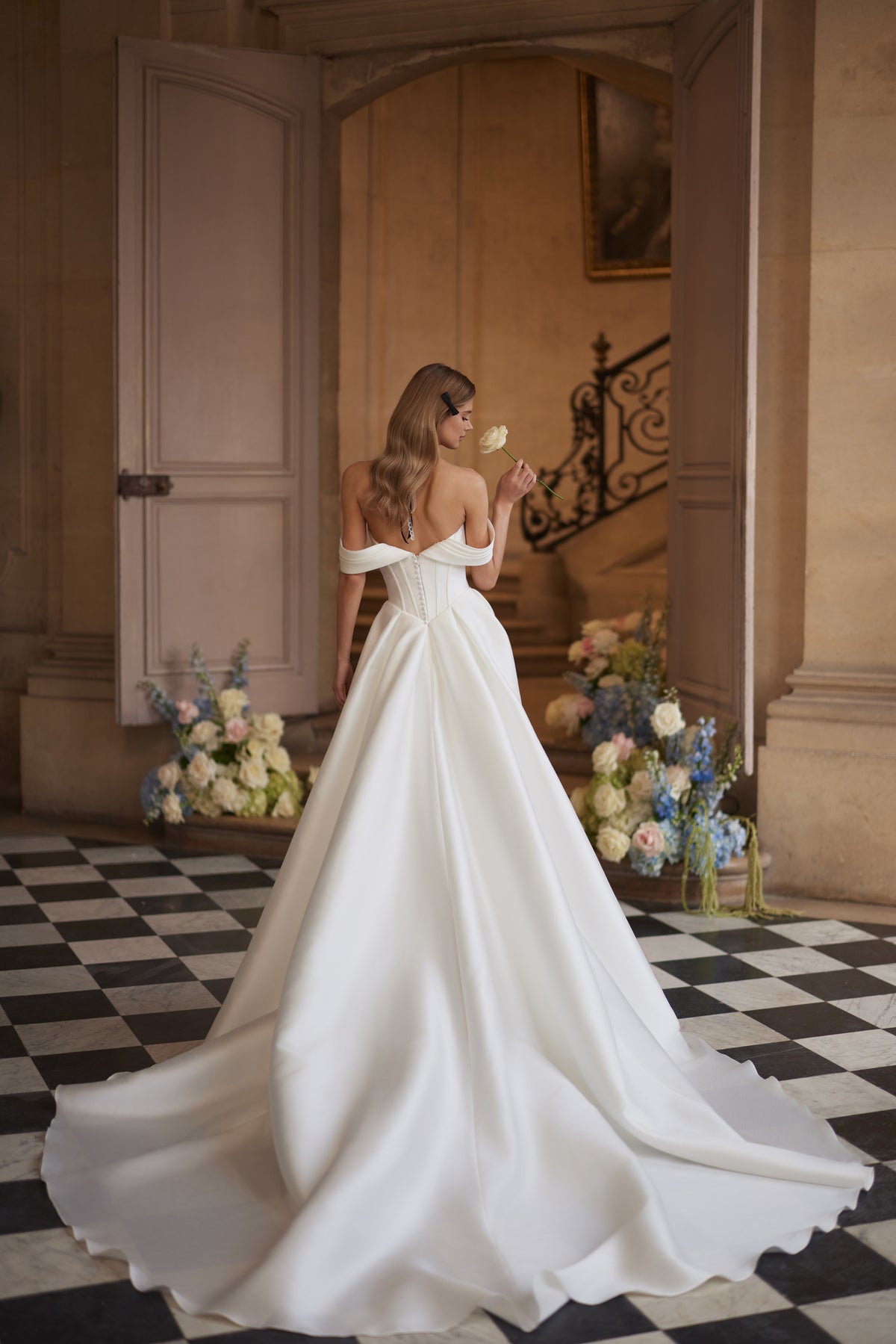 Alienor wedding dress – draped off-the-shoulder sleeves and a clean satin skirt.