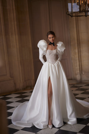 Aliette wedding dress – A-line silhouette with a crystal-embellished corset and voluminous sleeves.