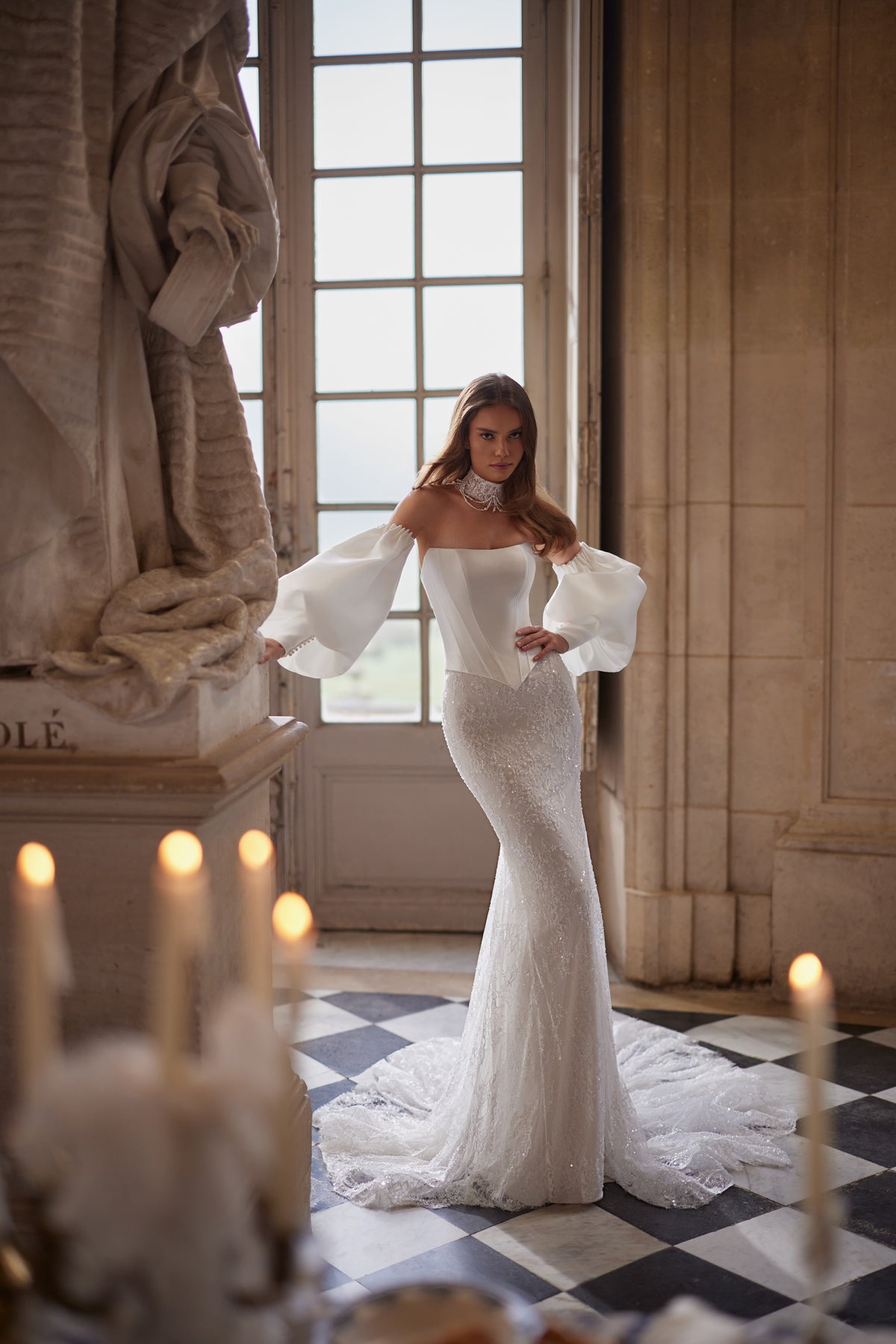 Anais wedding dress from the Something Blue 2027 collection – a sculptural lace bodice and voluminous off-the-shoulder sleeves.