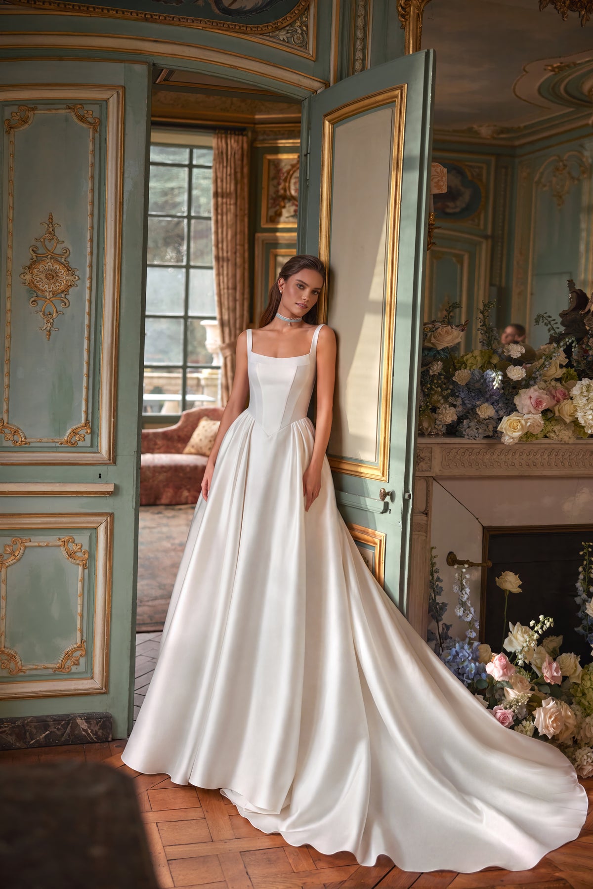 Aretuza wedding dress – a clean square neckline, slender straps and full satin skirt.
