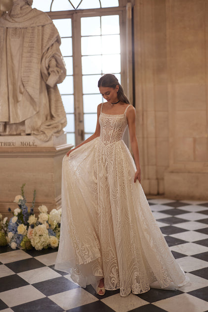 Frigga wedding dress – slender straps, a squared neckline and graphic lace ball skirt, DAMA Couture Something Blue 2027.