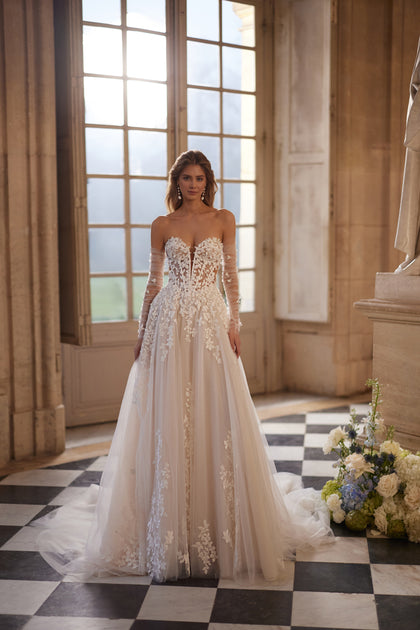 Ines wedding dress from the Something Blue 2027 collection – a sculpted strapless bodice and floral lace tulle skirt.