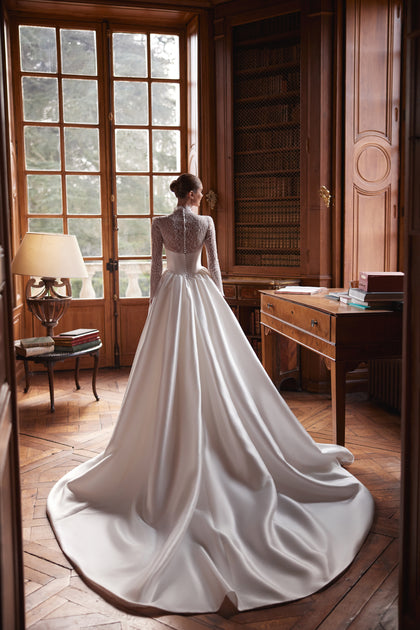 Maristella wedding dress – a high-neck lace bodice with long sleeves and full satin skirt, DAMA Couture Something Blue 2027.