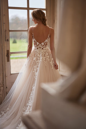 Solene wedding dress from the Something Blue 2027 collection – delicate straps, an open neckline and floral lace appliqués.