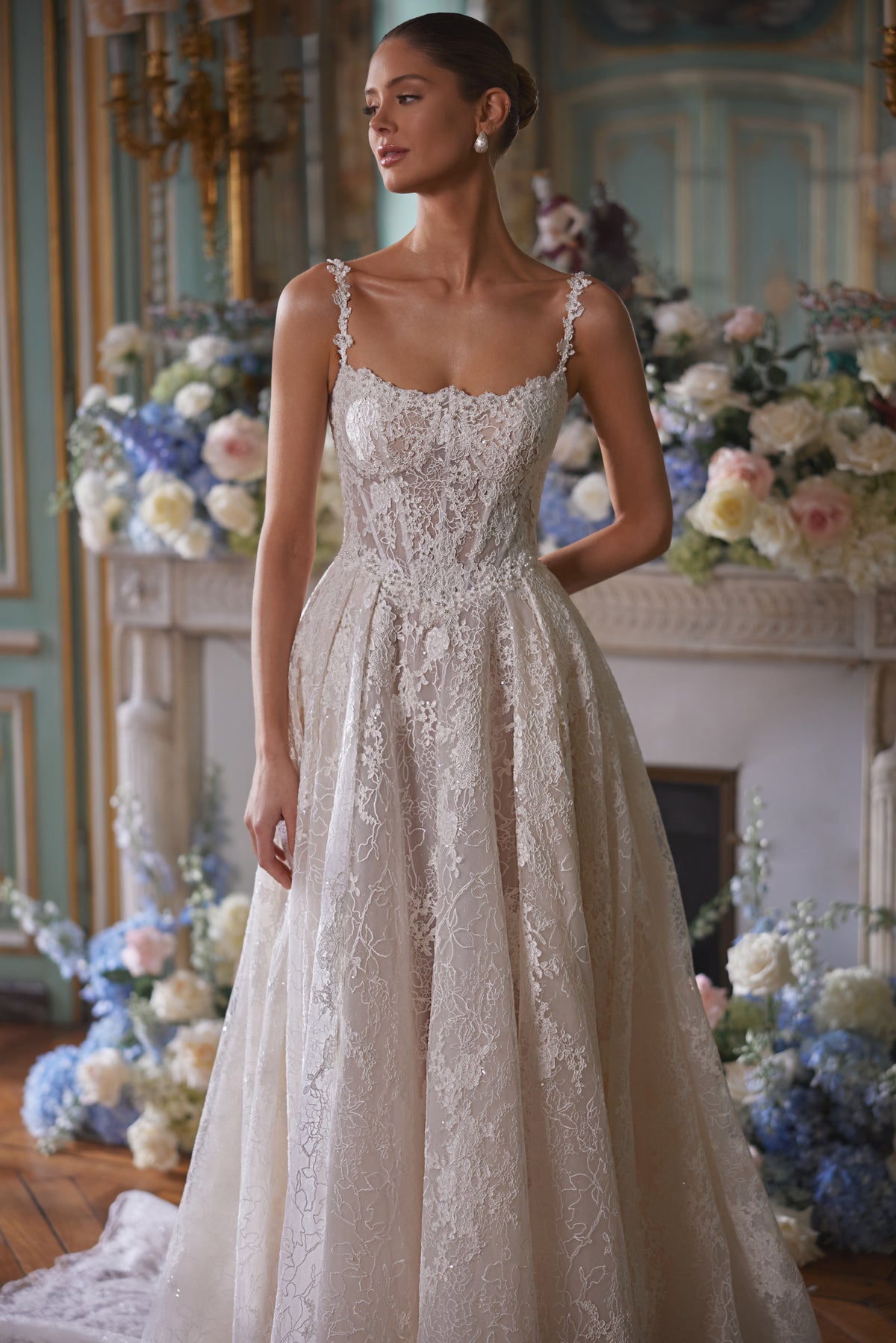 Thetis wedding dress – A-line wedding gown featuring sheer corsetry, lace straps and an opulent lace skirt.