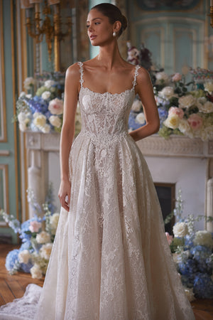 Thetis wedding dress – A-line wedding gown featuring sheer corsetry, lace straps and an opulent lace skirt.