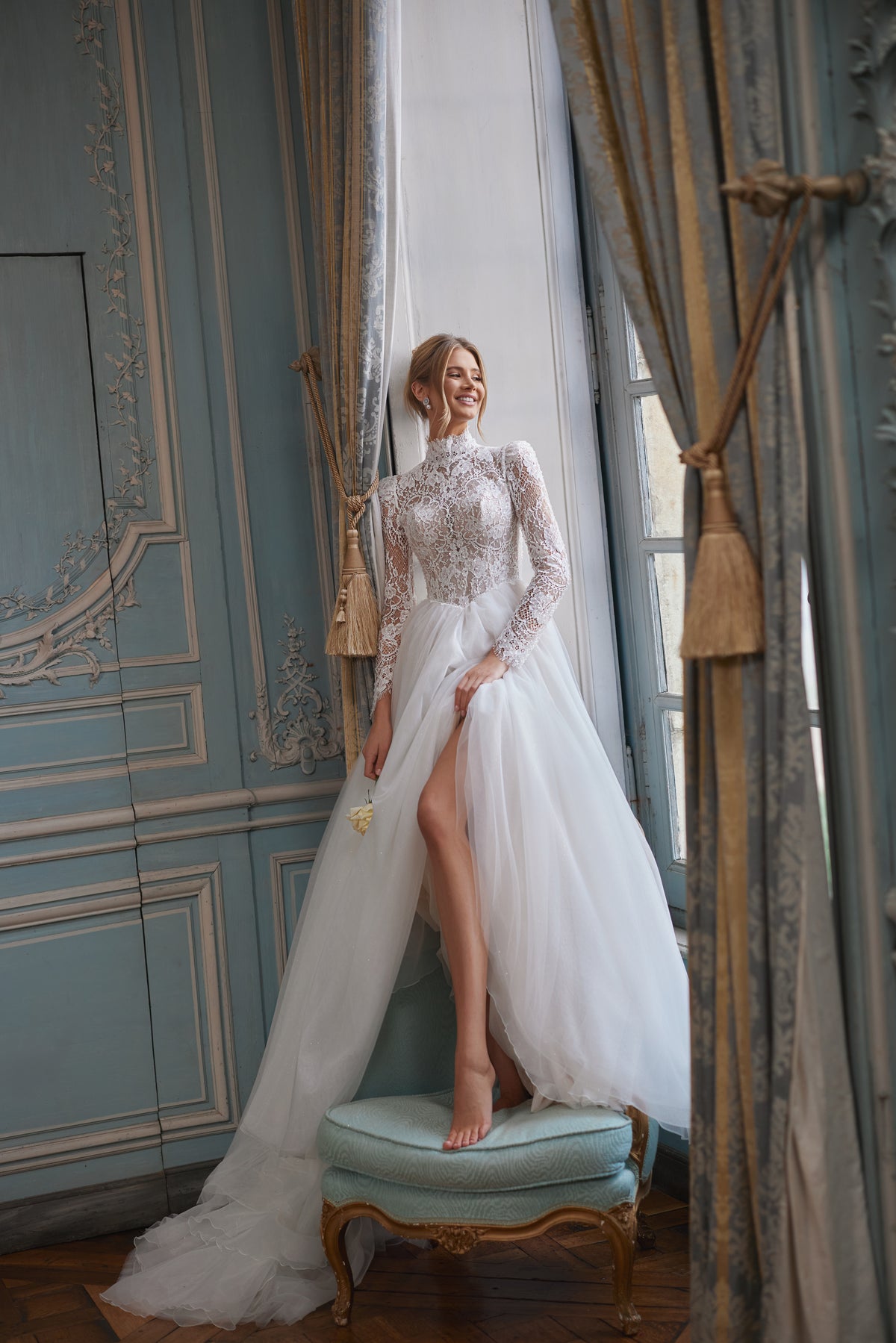 Tonia wedding dress – A-line bridal gown with a high neckline and long sheer lace sleeves.