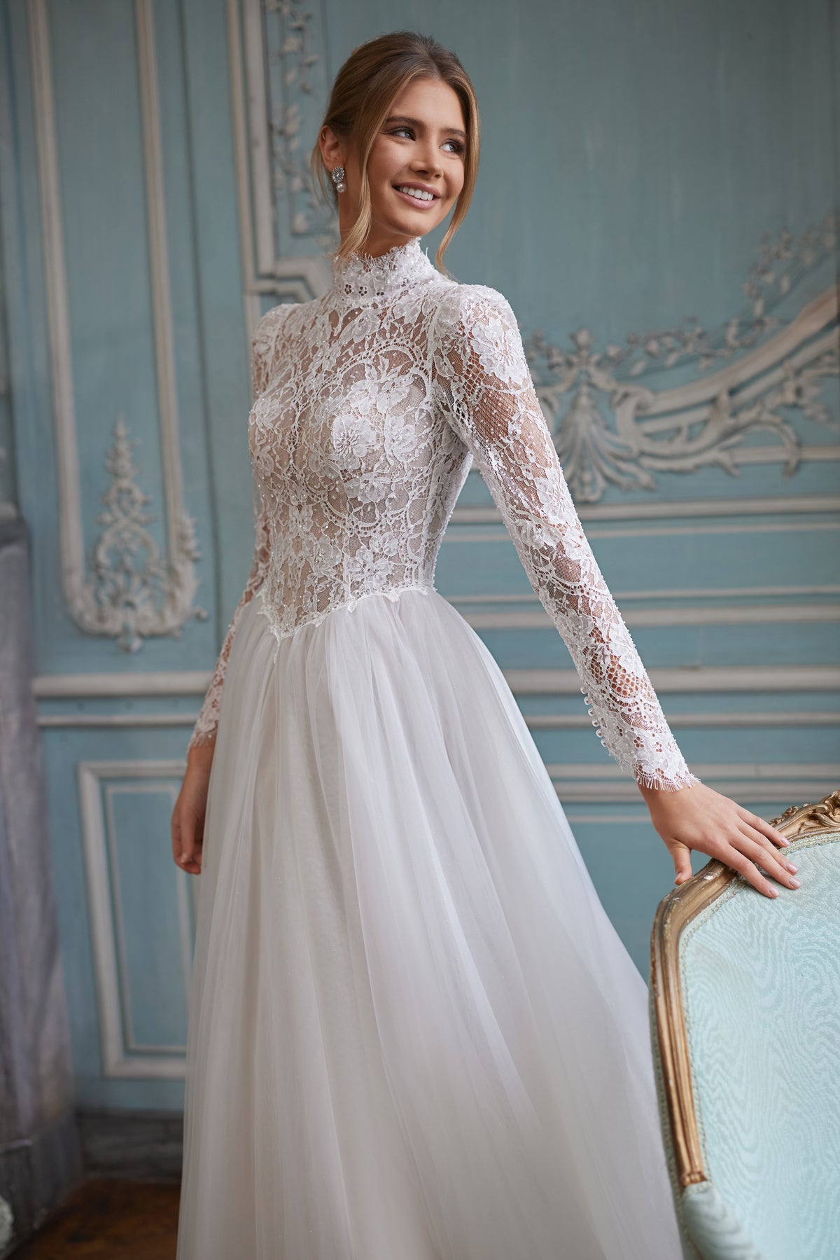 Tonia wedding dress – a high neckline and long sheer lace sleeves, DAMA Couture Something Blue 2027.