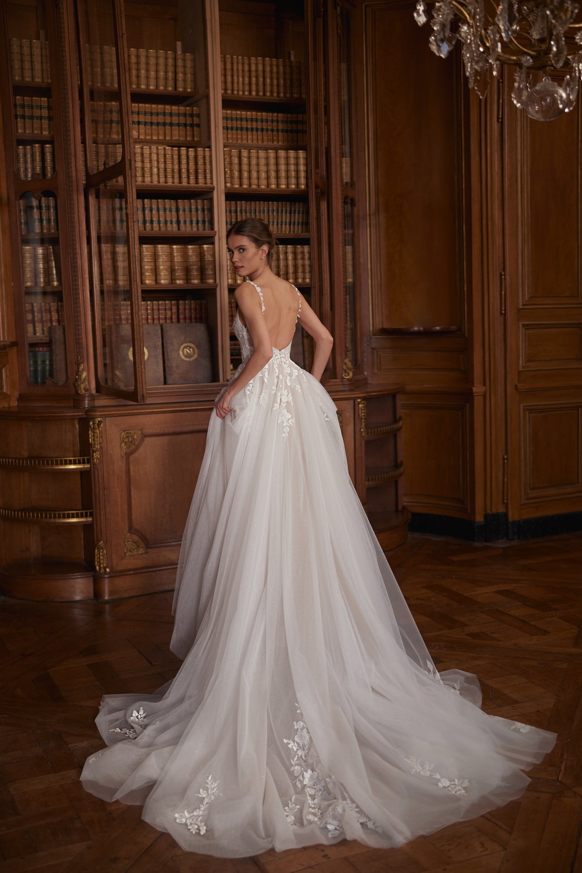 Veloria wedding dress – a V-neckline, floral straps and layered tulle skirt.