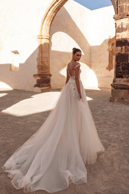 Close-up of the Andrea wedding dress shows the exquisite 3D lace bodice and sheer tulle details for a couture finish.