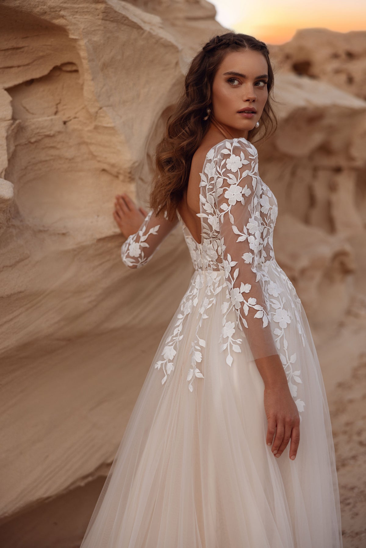 The back of the Armori wedding dress showcases sheer floral lace and a soft tulle skirt for a graceful, feminine silhouette.