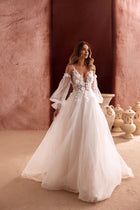 Lilibeth A-line wedding dress with sheer tulle sleeves and floral lace appliqués creates a dreamy, romantic bridal look.