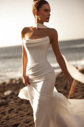 The Luna wedding dress features a cowl neckline and structured bodice, perfect for the modern minimalist bride.