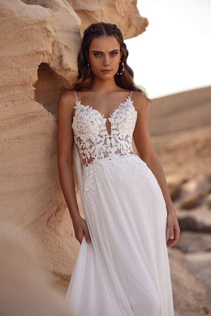 The Malika bridal gown showcases an exquisite lace leaf train — perfect for a fairytale boho wedding.