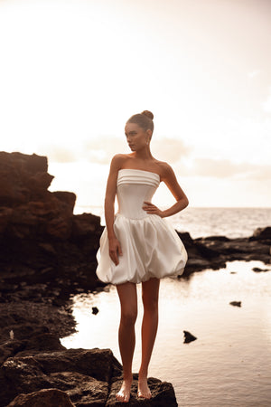 Martini short strapless wedding dress with a bustier corset and bubble skirt is perfect for a modern civil ceremony or beach elopement.