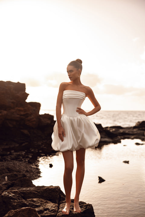 Martini short strapless wedding dress with a bustier corset and bubble skirt is perfect for a modern civil ceremony or beach elopement.
