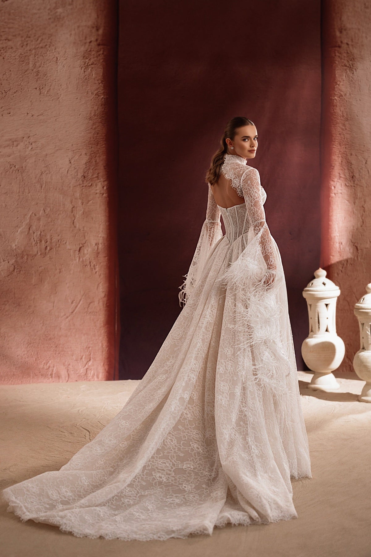 The Michelle lace bridal bolero with open back and delicate details creates a glamorous wedding look.