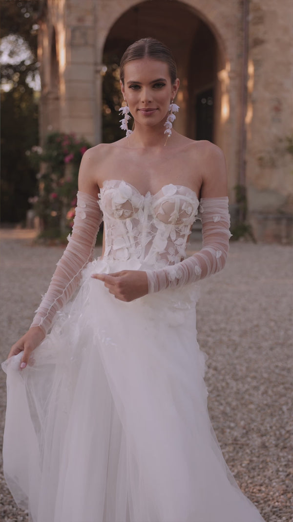Ethernal romantic wedding dress with sleeves Ilimaris from DAMA Couture (campaign video)