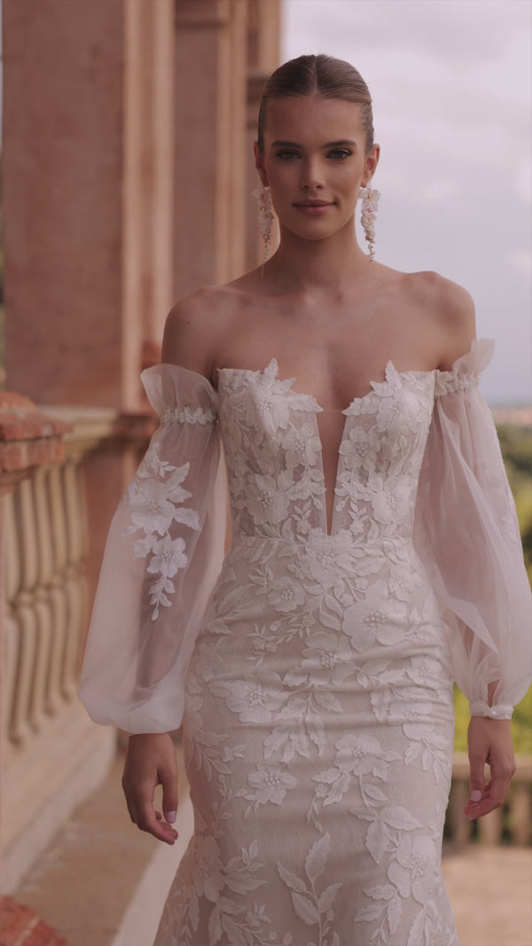 Romantic wedding dress with falling sleeves Lucrezia from DAMA Couture (campaign video)