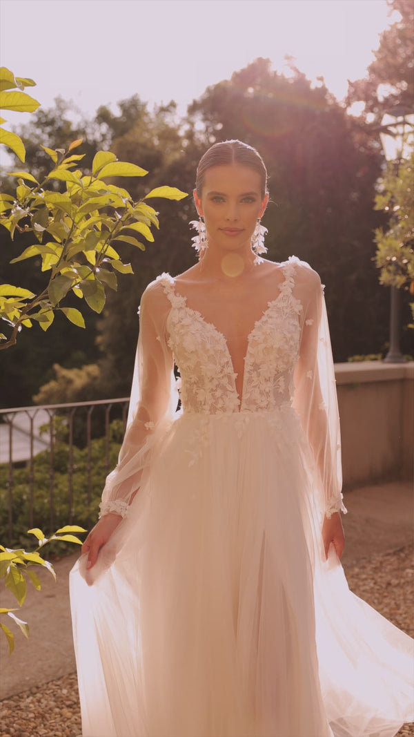 Romantic lace a-line wedding dress with detachable sleeves from DAMA Couture (campaign video)
