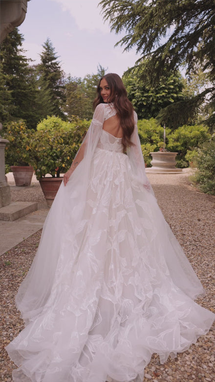 Modern bohemian wedding dress with lace bolero Calla from DAMA Couture (campaign video)