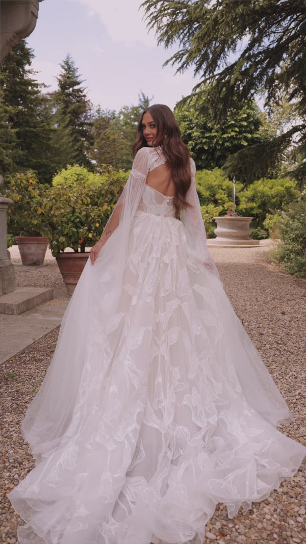 Modern bohemian wedding dress with lace bolero Calla from DAMA Couture (campaign video)