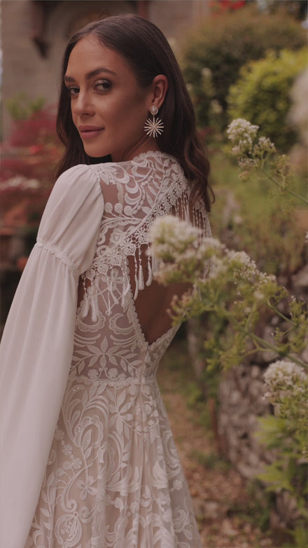 Bohemian wedding dress Cassidy with sleeves for destination wedding from DAMA Couture (secondary video)