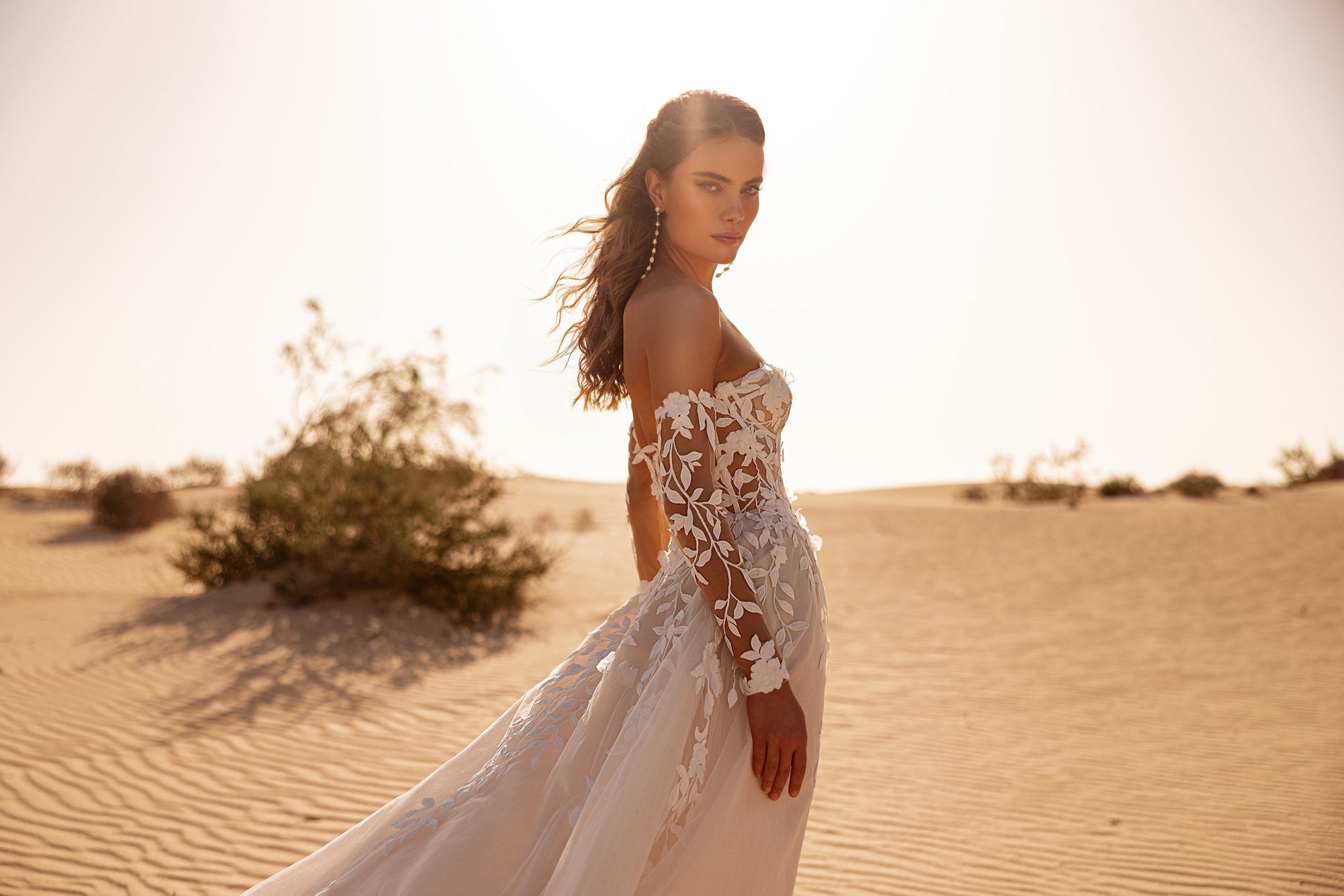 The Tamara wedding gown with sweetheart corset and floral appliqués blends modern design with timeless romance.