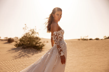 The Tamara wedding gown with sweetheart corset and floral appliqués blends modern design with timeless romance.