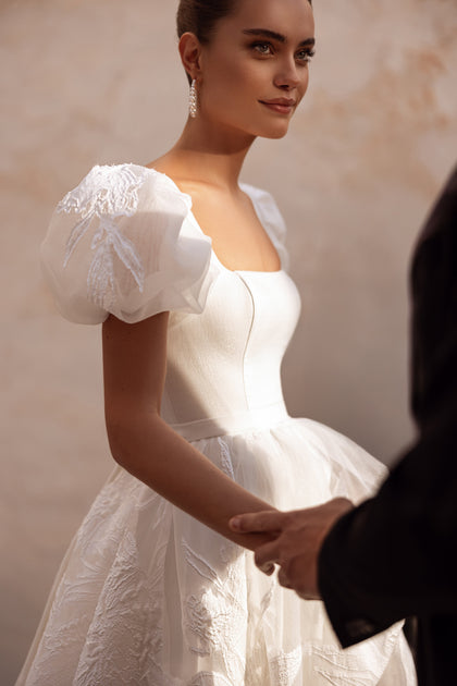 The Vanilla wedding gown with full floral-embroidered skirt is the perfect choice for a romantic bride.